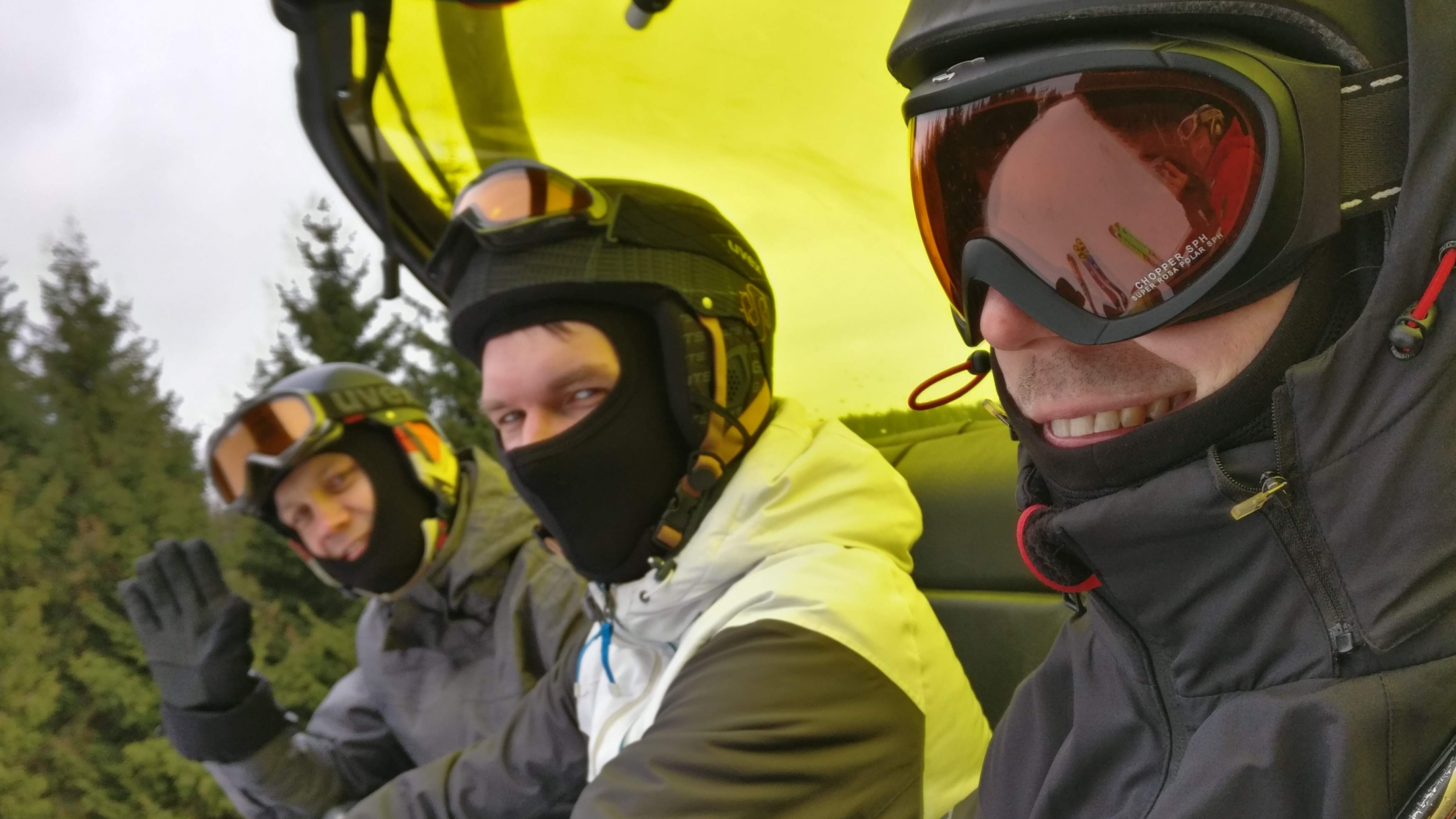 Smiling Silk employees on the ski lift