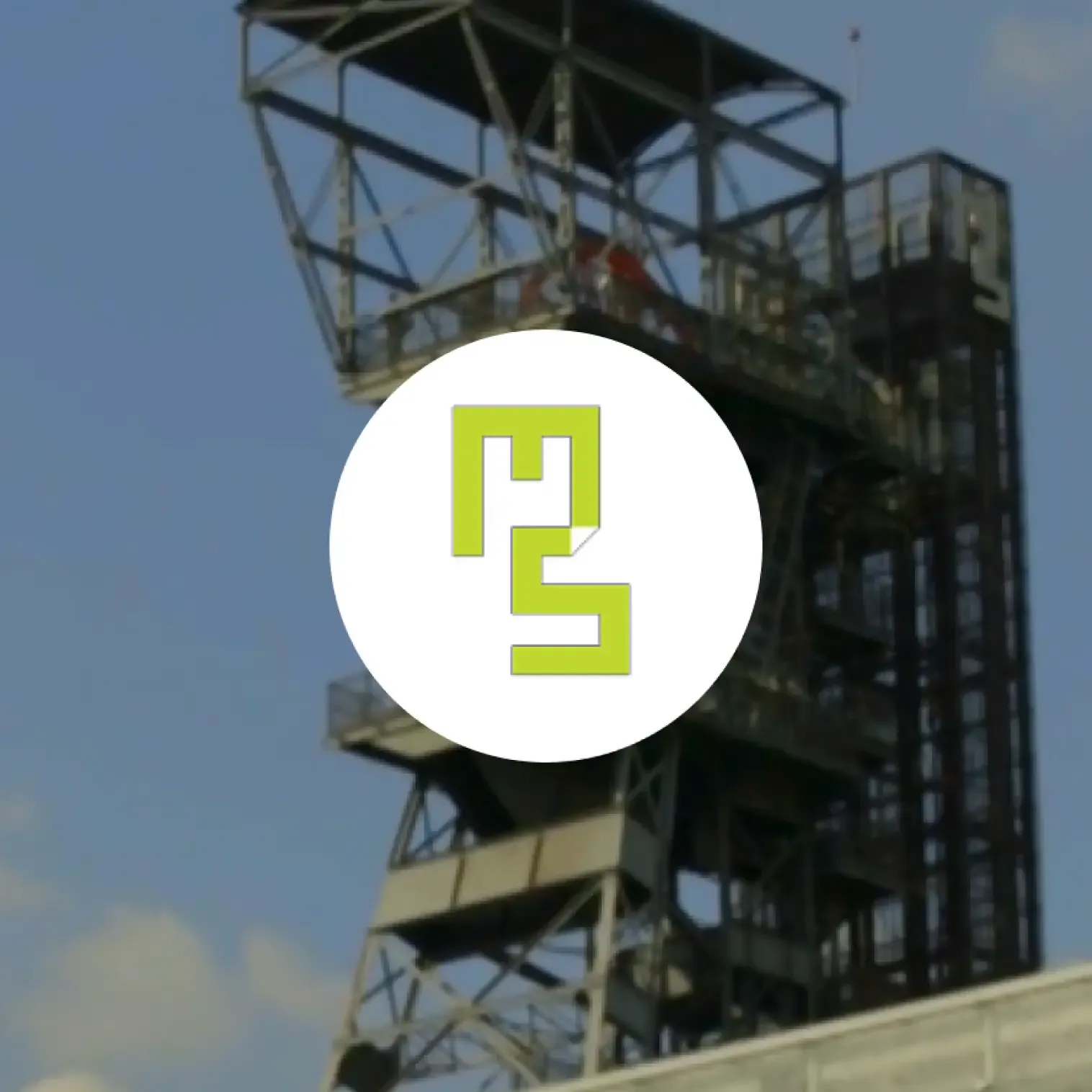 Muzeum Śląskie's logo on the background of the hoisting shaft