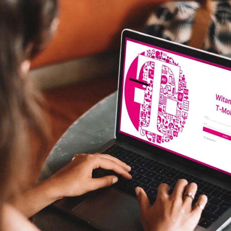 woman logging into the telecommunications service management system in the brand colors of T-Mobile.